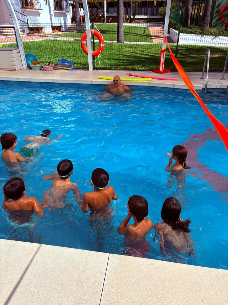 Small-group swimming lesson for children at Casa Ángeles Marbella