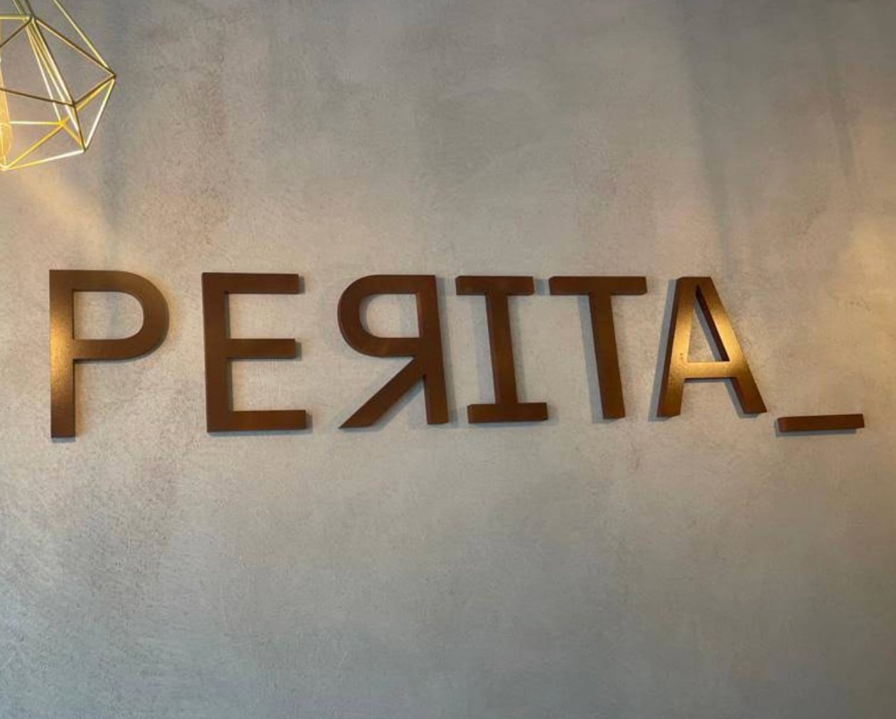 Interior detail with signature lettering at Perita, Marbella
